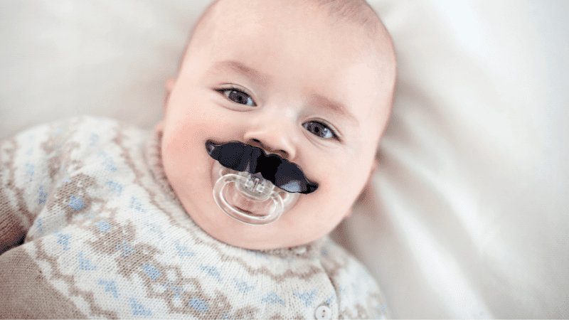A baby has a cute pacifier