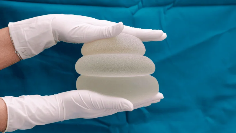 A man is pressing the flexible silicone rubber.